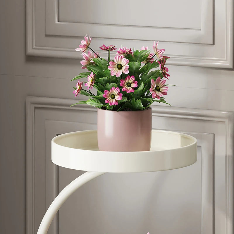Stylish modern plant stand indoor showcasing a potted flower arrangement in a contemporary setting
