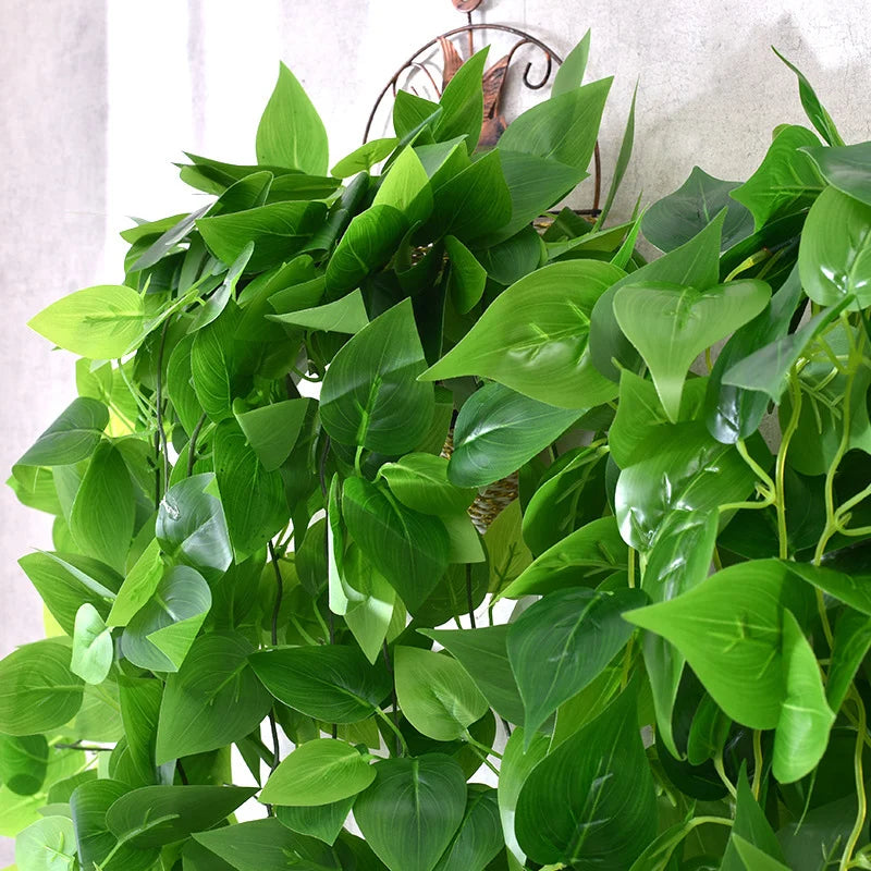 Lush green outdoor plastic creeper plants cascading from a decorative hanging basket
