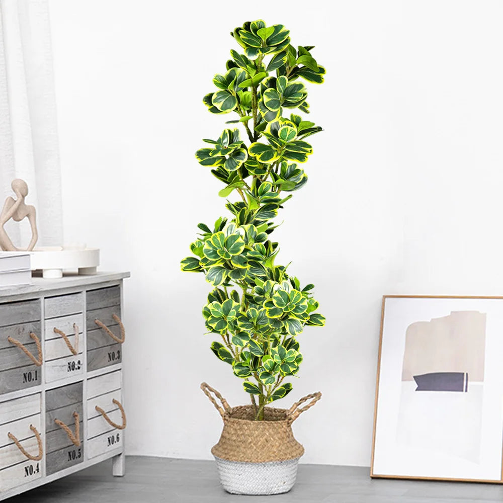 Tall artificial indoor plant in a decorative woven basket for home or office decor