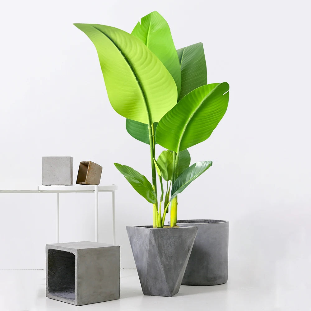 Artificial Green Plant with Large Leaves in Modern Gray Planter for Stylish Home Decor
