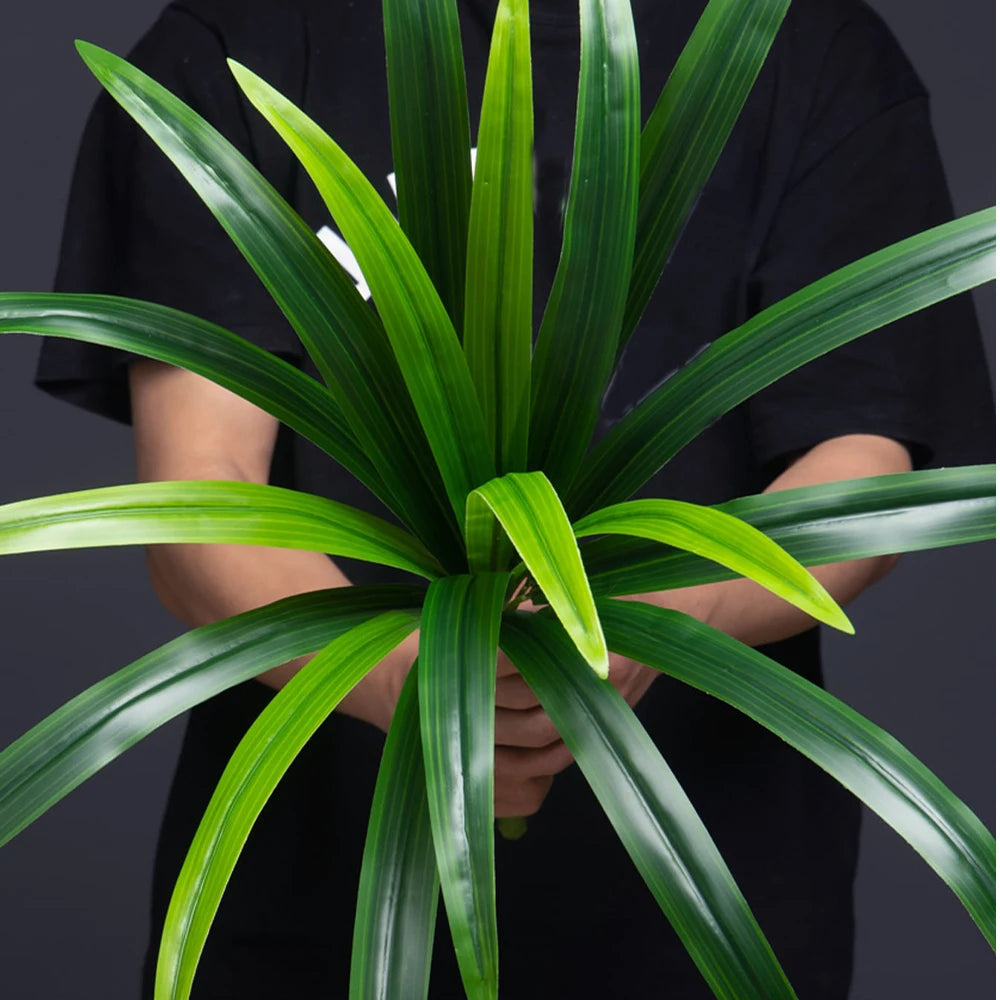 Lifelike artificial plant with long green leaves, perfect for home or office decor