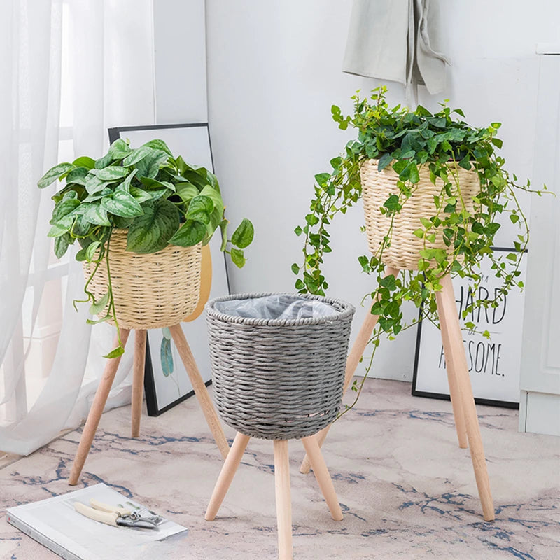 Set of Three Stylish Plant Stands with Natural Woven Baskets and Wooden Legs for Indoor Plants