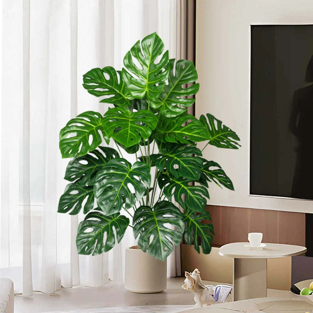 Lifelike plastic turtle leaf indoor plant adding greenery to a bright living room setting