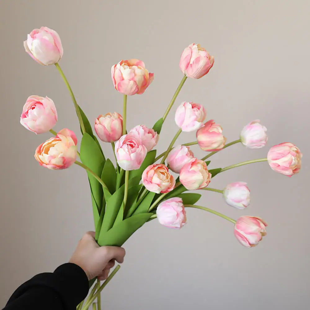 Beautiful artificial pink tulip bouquet with realistic petals and green stems for home decor