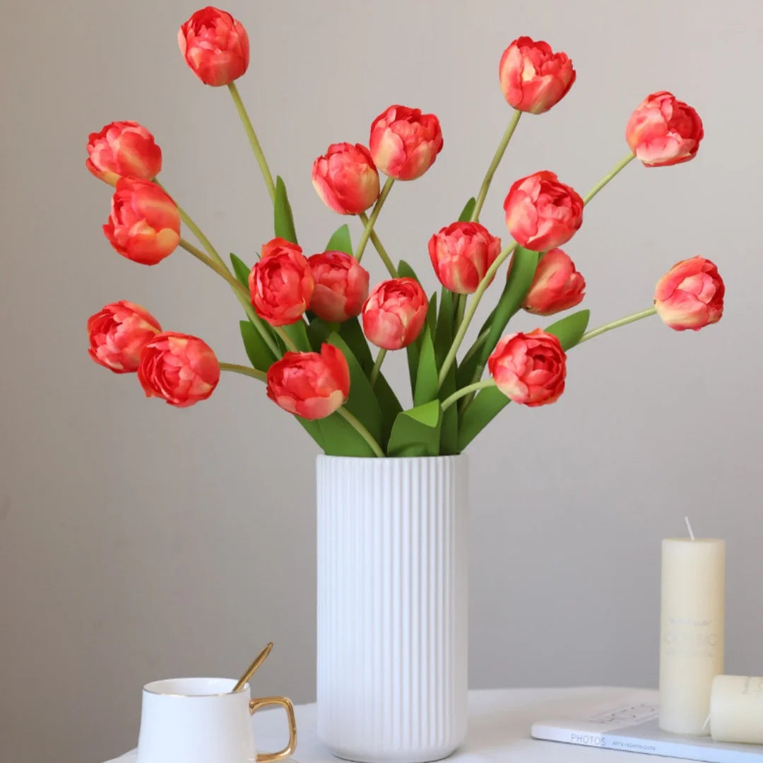Artificial red tulip bouquet in a white ribbed vase for home decor and table arrangements