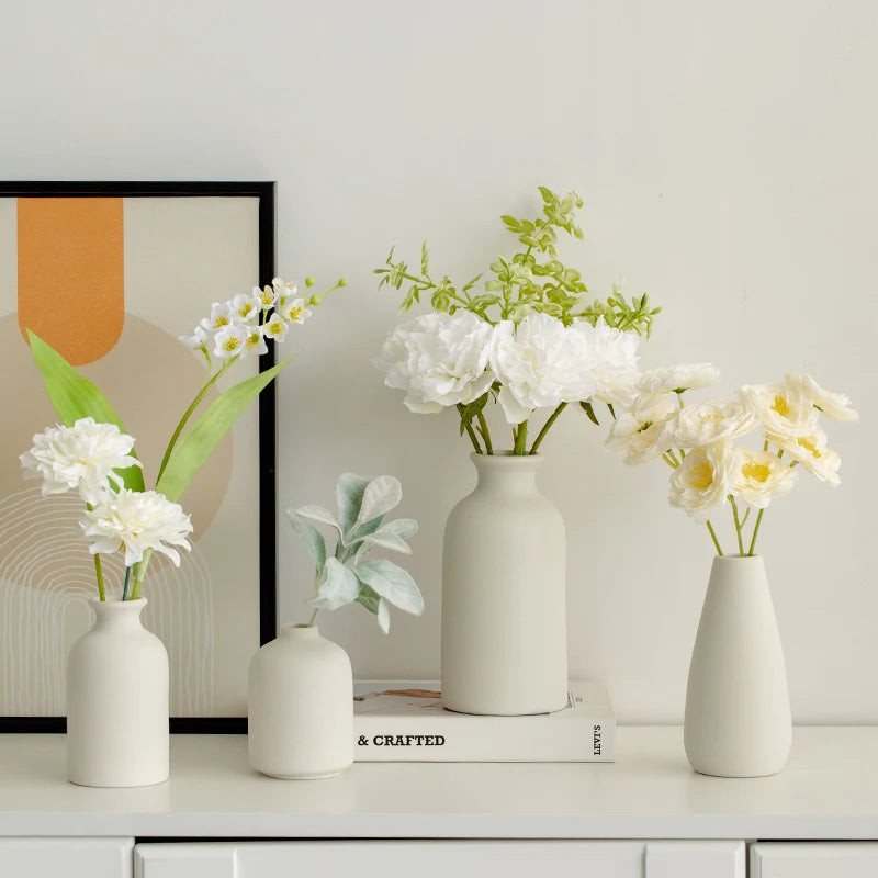 Set of decorative vases from Mağazam filled with white and green artificial flowers for home decor
