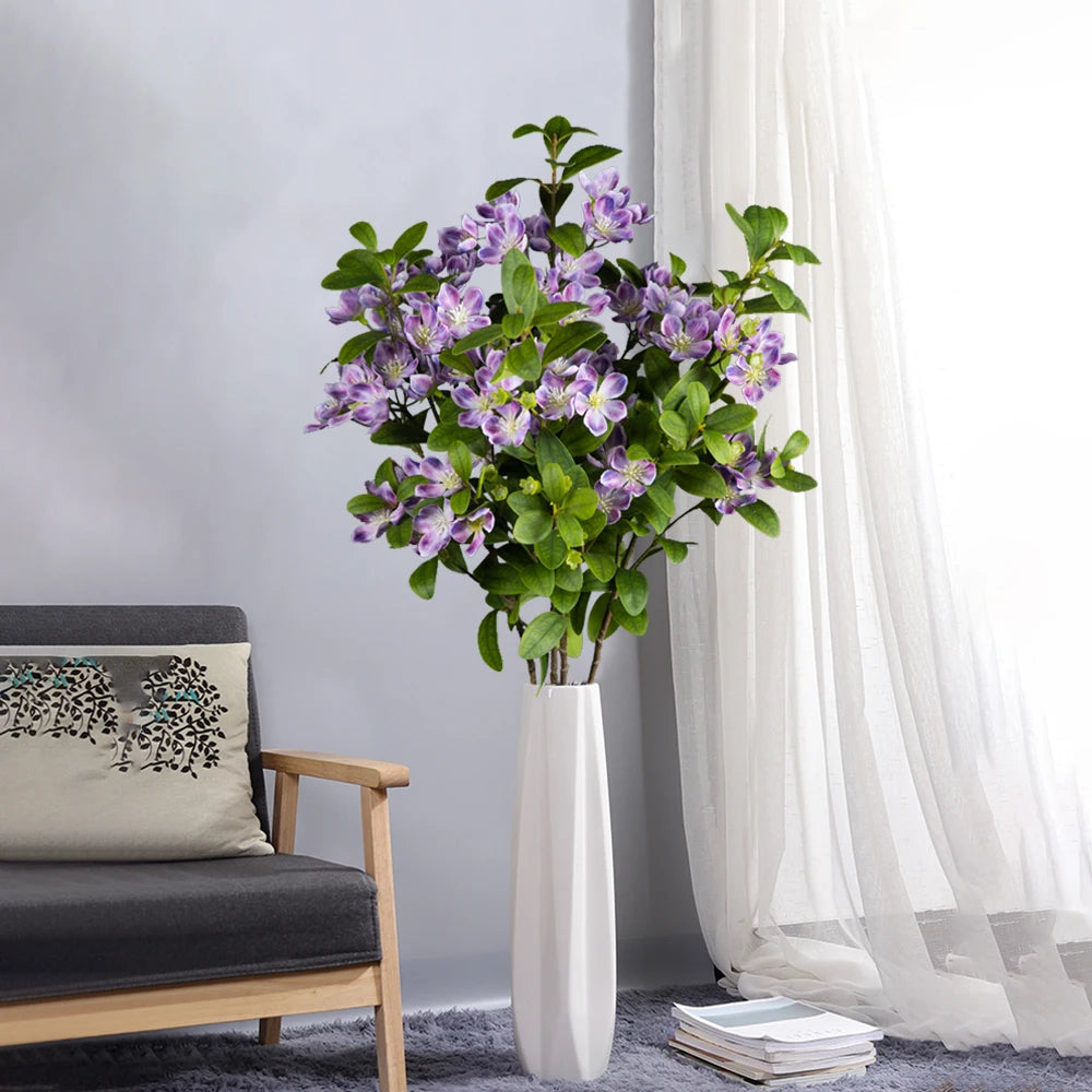 Artificial Purple Flower Arrangement in a White Vase for Home Decoration