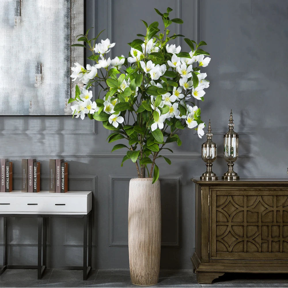 Elegant artificial magnolia tree in a decorative vase for home decor enhancement