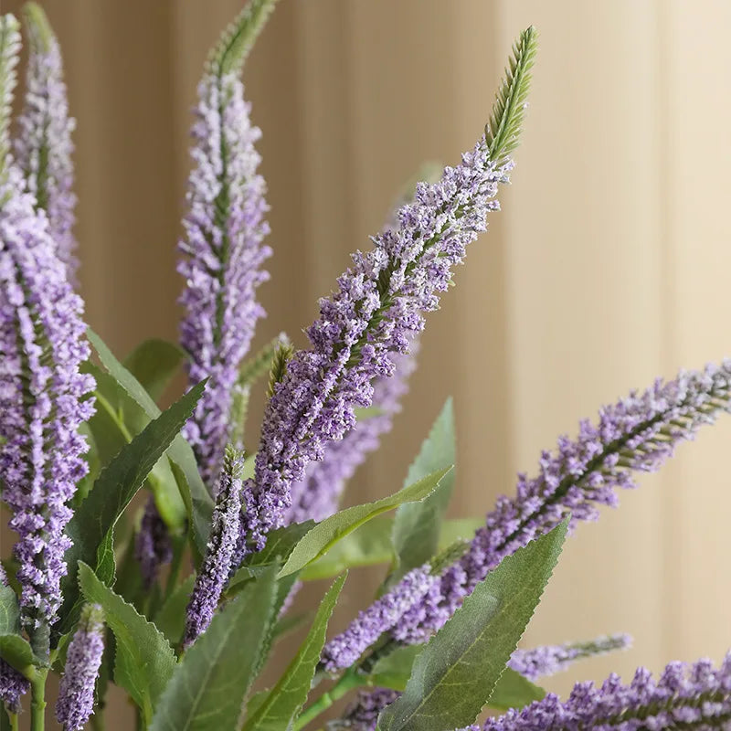Lavender artificial flower arrangement in a decorative vase for home decor