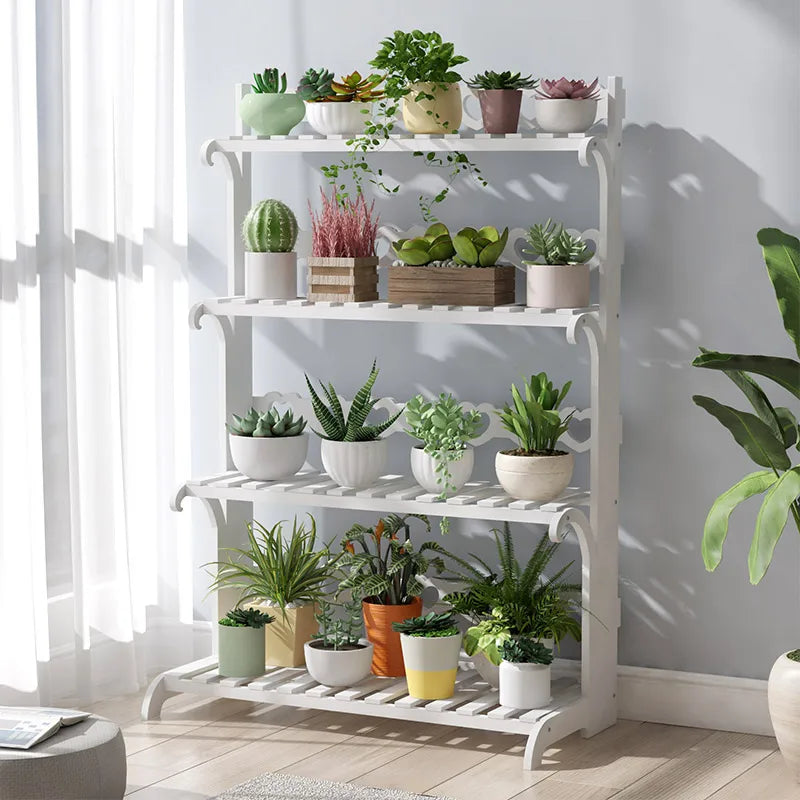 Wooden plant shelf indoor with multiple tiers displaying various potted plants in vibrant colors